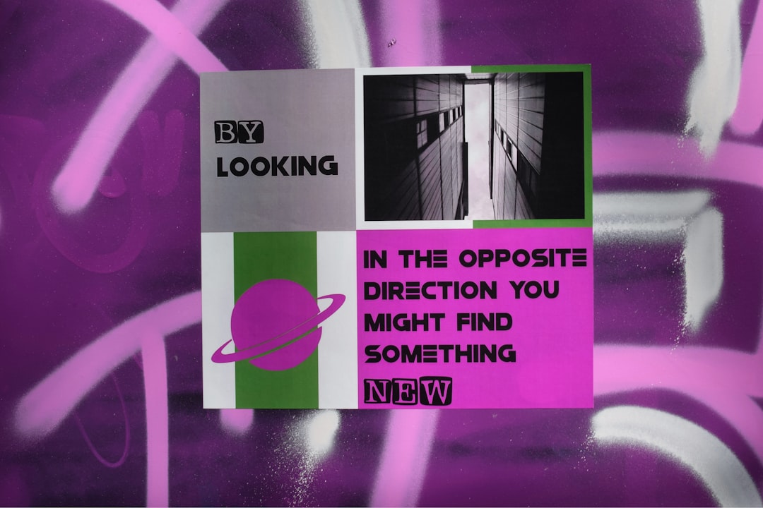 Property manager looking stressed at a desk covered in papers and screens